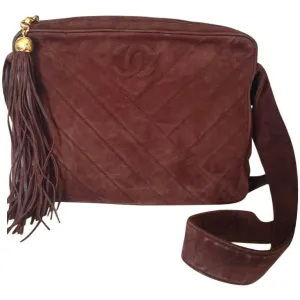 Vintage CHANEL dark brown V stitch suede leather shoulder bag with CC stitch mark and long tassel. Best Chanel purse for fall and winter.